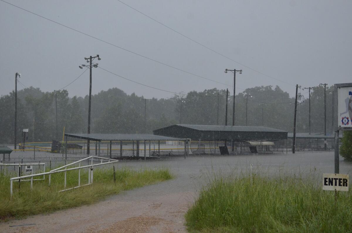 Floodwaters surround a baseball field in Kentwood, La., on Friday.