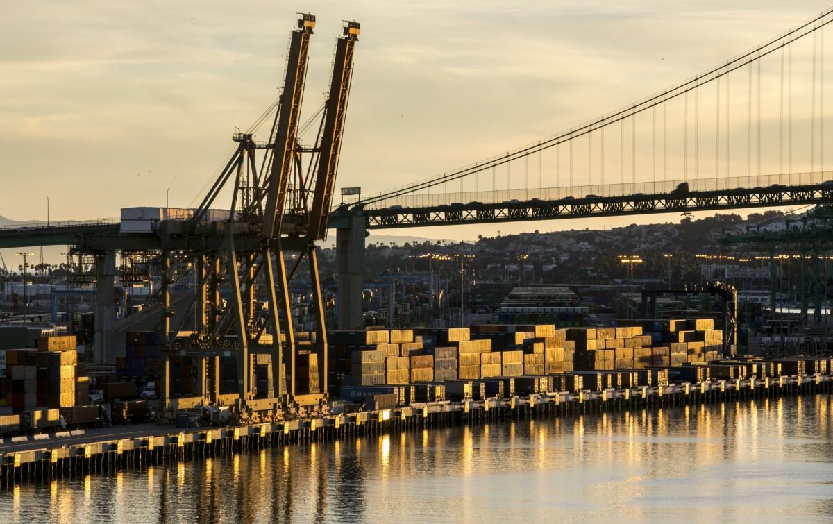 Shipping containers are stacked up at the Port of Los Angeles in January. A protracted labor dispute at West Coast seaports led to major declines in imports on the Pacific. East and Gulf coast ports saw an uptick in recent months.