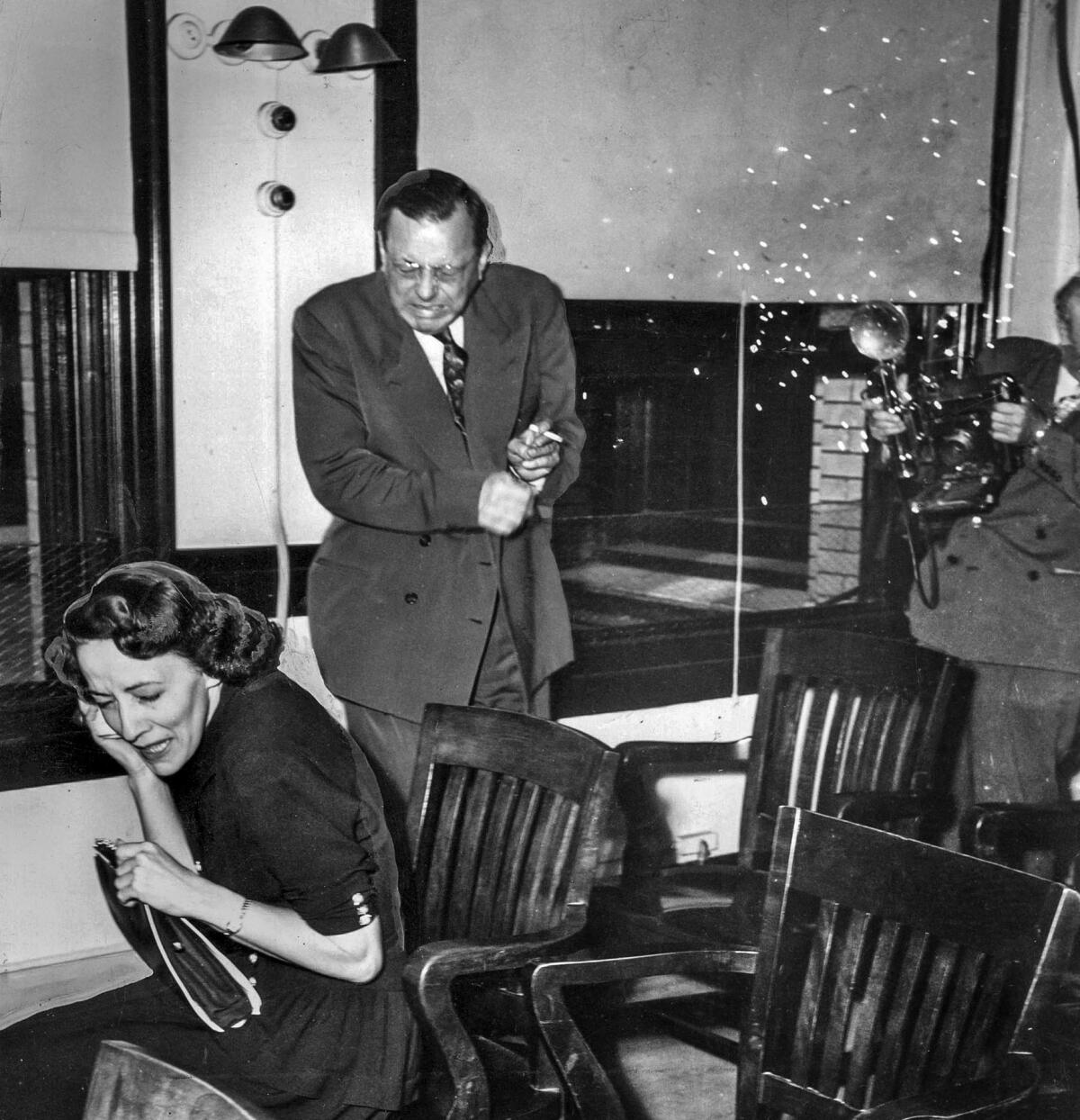 July 29, 1948: Doris Mae Normandine, attorney Werner O. Graf and a Los Angeles Examiner photographer