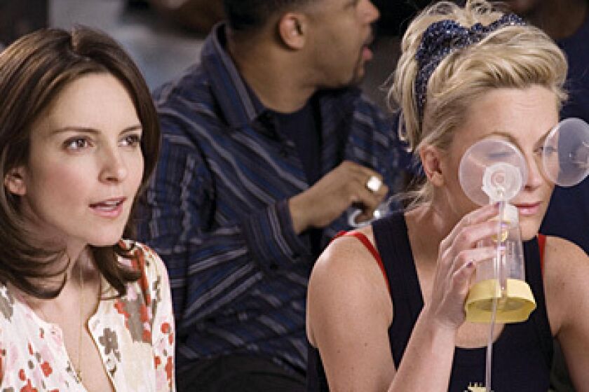 CLASS CLOWNS AND PROM QUEENS: Tina Fey, left, and Amy Poehler are sidekicks in the lead in Baby Mama.