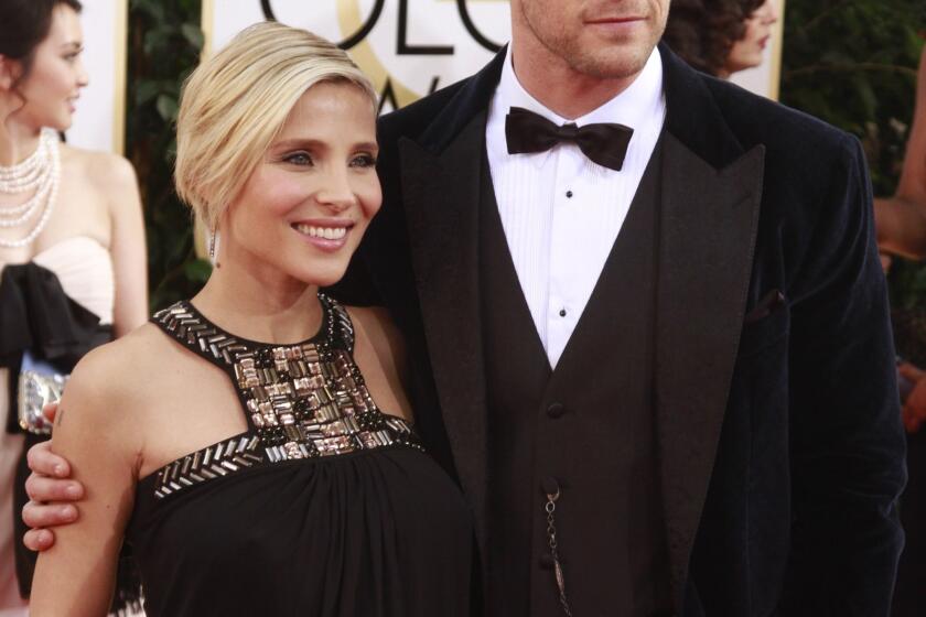 "Thor: The Dark World's" Chris Hemsworth and his wife, Elsa Pataky, are expecting twins. They are pictured at the 2014 Golden Globe Awards.