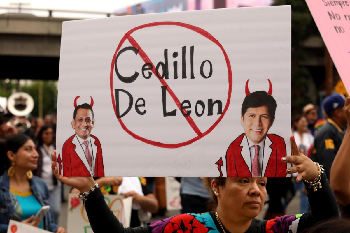 Marchers hold a sign.