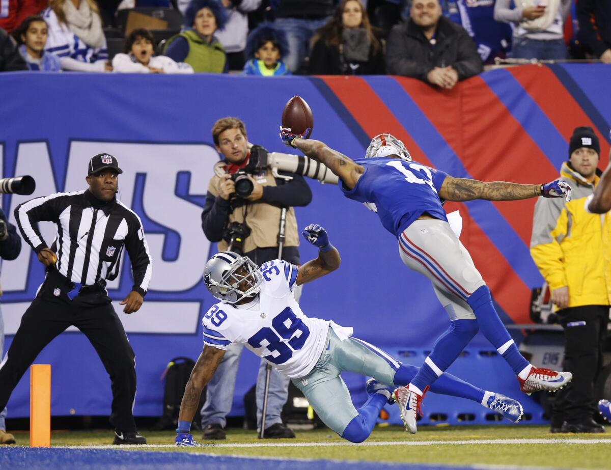 The New York Giants' Odell Beckham Jr. makes a one-handed catch for a touchdown against the Dallas Cowboys during a Nov. 23, 2014, game in East Rutherford, N.J.