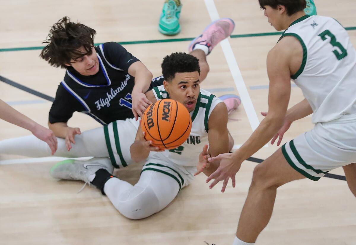 Sage Hill's Sergio Maggette (2) dives to keep possession of a loose ball against La Habra in the Division 3AA playoffs.