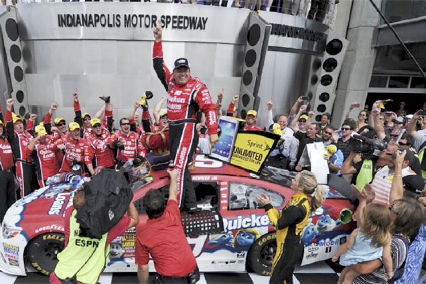 NASCAR Sprint Cup Series driver Ryan Newman celebrates after winning the Brickyard 400 auto race at the Indianapolis Motor Speedway on Sunday.