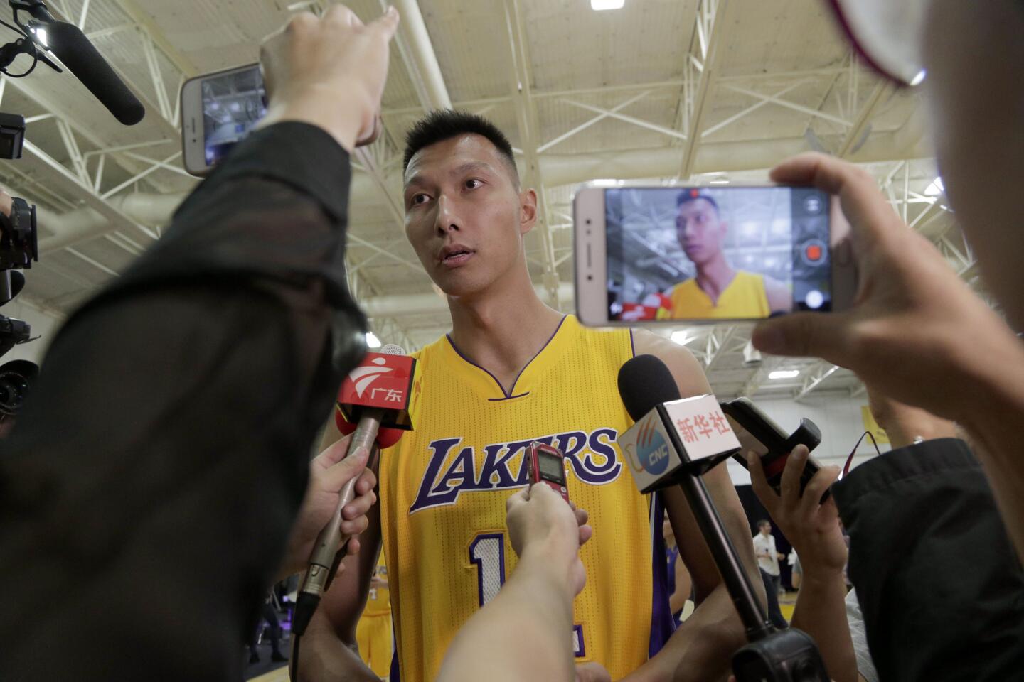Los Angeles Lakers' Yi Jianlian talks to reporters during the team's NBA basketball media day in El Segundo, Calif., on Monday, Sept. 26, 2016. (AP Photo/Nick Ut)