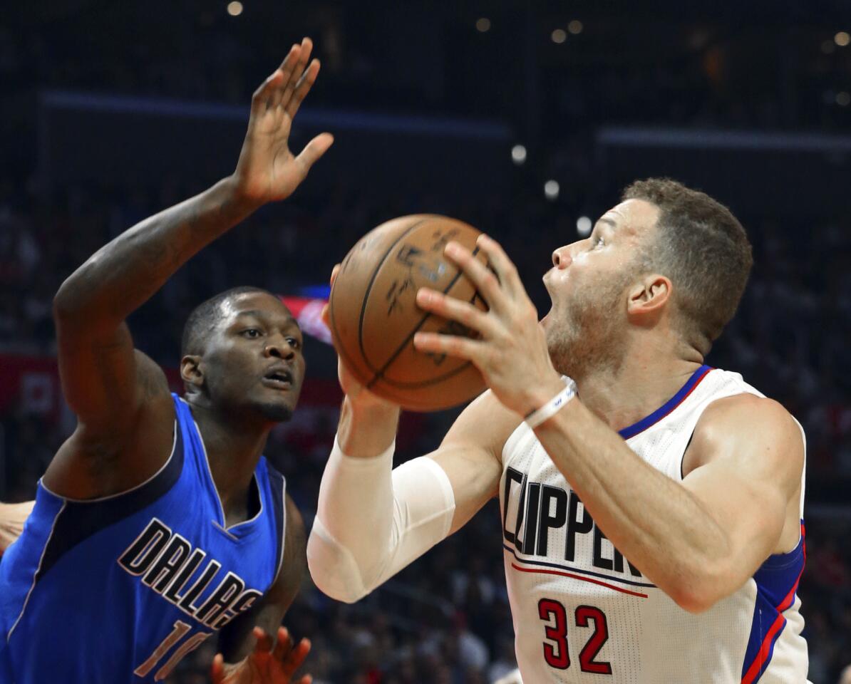 Clippers forward Blake Griffin looks to score against Mavericks guard Yogi Ferrell during the first half.