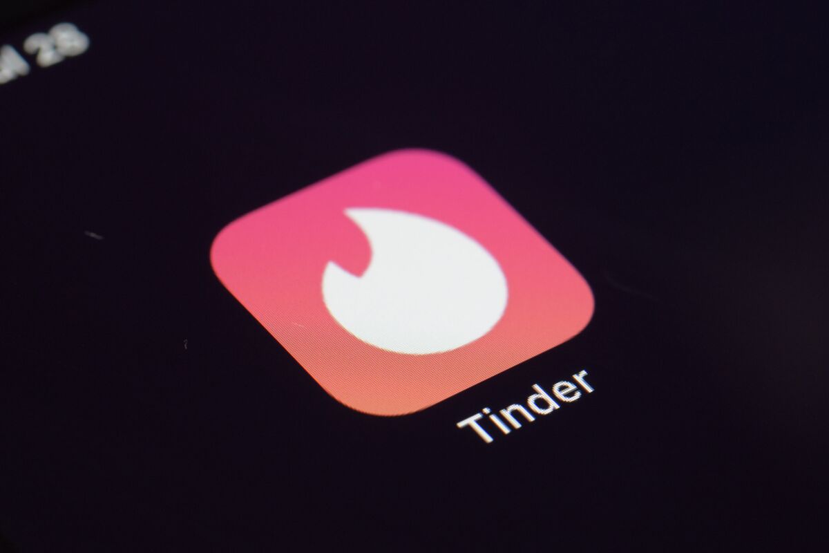 FILE - This Tuesday, July 28, 2020, file photo shows the icon for the Tinder dating app on a device in New York. The use of dating apps in the last 18 months of the pandemic has surged around the globe. Tinder reported 2020 as its busiest year. (AP Photo/Patrick Sison, File)