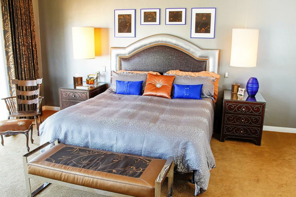Marlene Holmquist’s western-themed master bedroom, with embossed leather headboard. — Eduardo Contreras