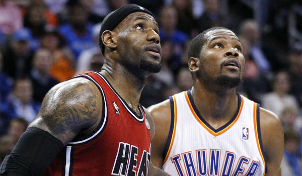 LeBron James, left, and the Miami Heat defeated Kevin Durant and the Oklahoma City Thunder, 110-100, Thursday night.