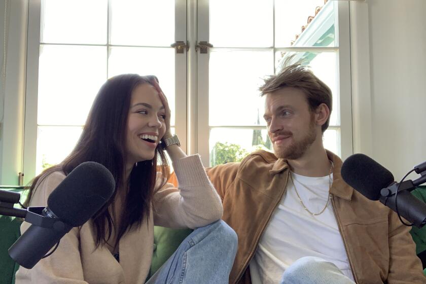 Finneas O'Connell and Claudia Sulewski record their podcast, "We Bought a House" inside their L.A. home. The couple launched their podcast on March 23, part of a surge of new podcasts uploaded to Spotify during the coronavirus crisis.