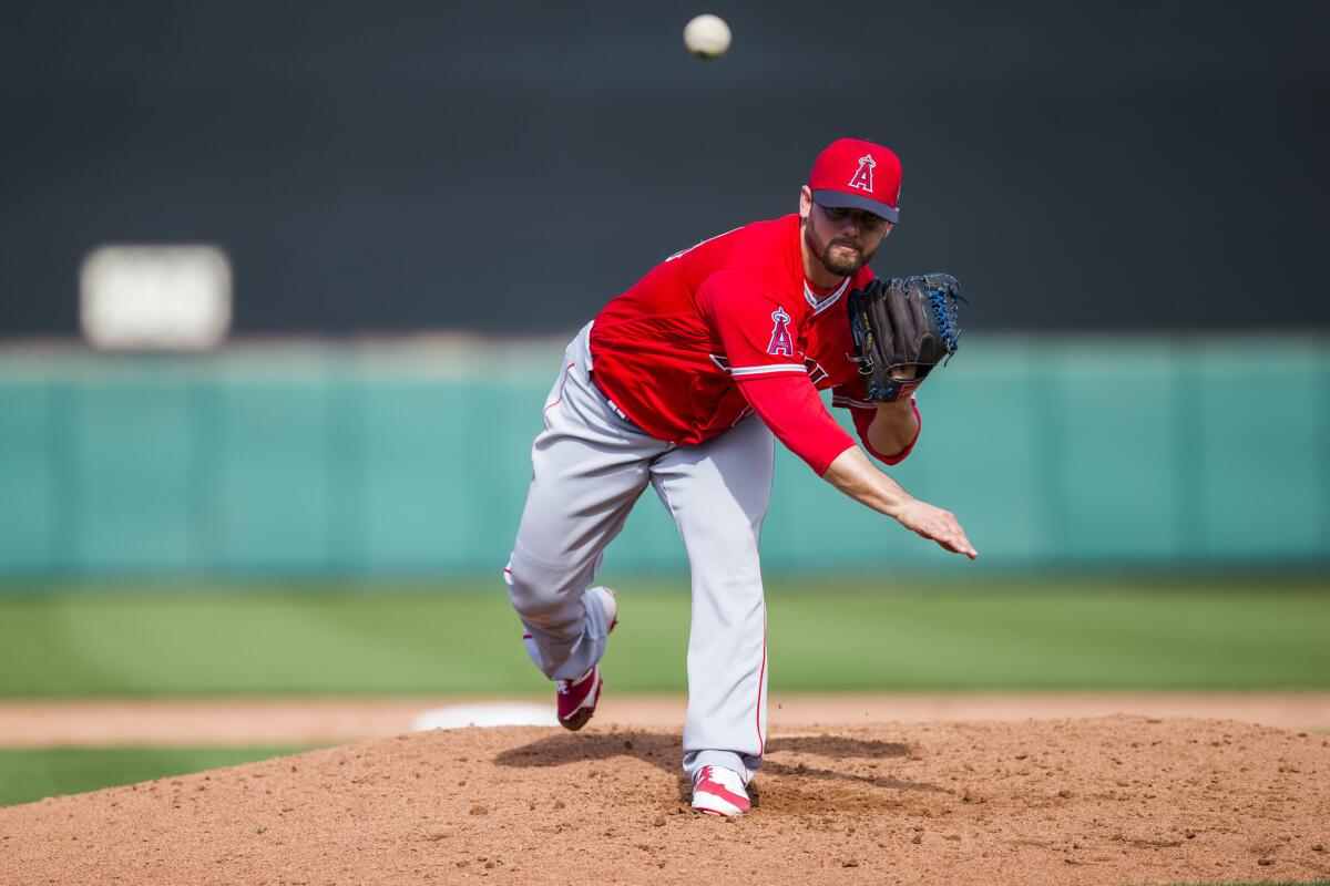 Reliever Cam Bedrosian pitches during a spring training game against the Giants on March 2.