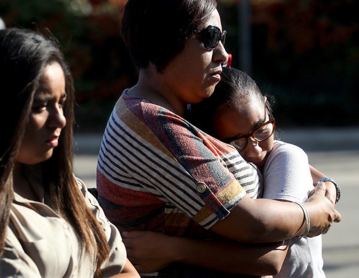 Diane Garcia comforts hear daughter Ciana, 11, during the unveiling of a memorial plaque in honor of victims of the Metrolink crash in Chatsworth five years ago. Garcia's nephew, Manuel Macias, 32, was of 24 people who died in the accident.