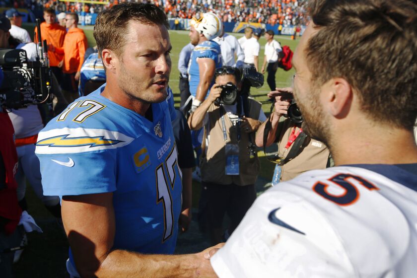 San Diego Chargers Philip Rivers congratulates Denver Broncos Joe Flacco after the Broncos 20-13 win in Carson on Oct. 6, 2019.