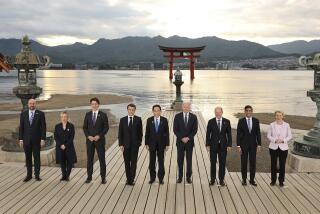 G7 leaders, from left to right, European Council President Charles Michel, Italian Prime Minister Giorgia Meloni, Canadian Prime Minister Justin Trudeau, French President Emmanuel Macron, Japanese Prime Minister Fumio Kishida, U.S. President Joe Biden, German Chancellor Olaf Scholz, Britain's Prime Minister Rishi Sunak, and European Commission President Ursula von der Leyen, pose for a group photo as they visit the Itsukushima Shrine on Miyajima Island in Hatsukaichi, western Japan, Friday, May 19, 2023. (Japan Pool via AP)