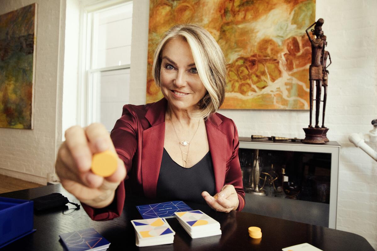 Psychotherapist Esther Perel at her Manhattan home with her new board game, "Where Should We Begin." 