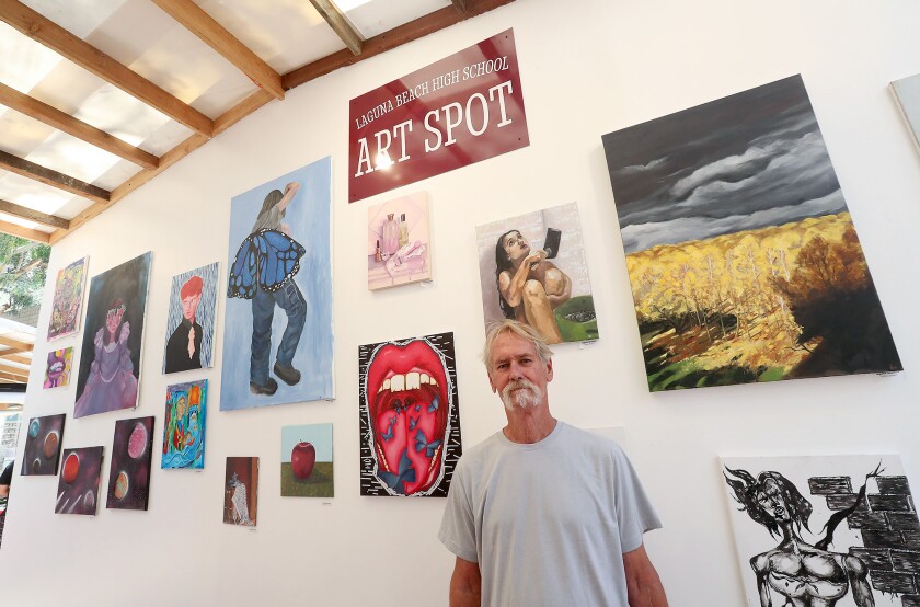 Bud Weir, a local artist and exhibitor, stands in the Laguna Beach High School Art Spot, a mini-gallery he championed.