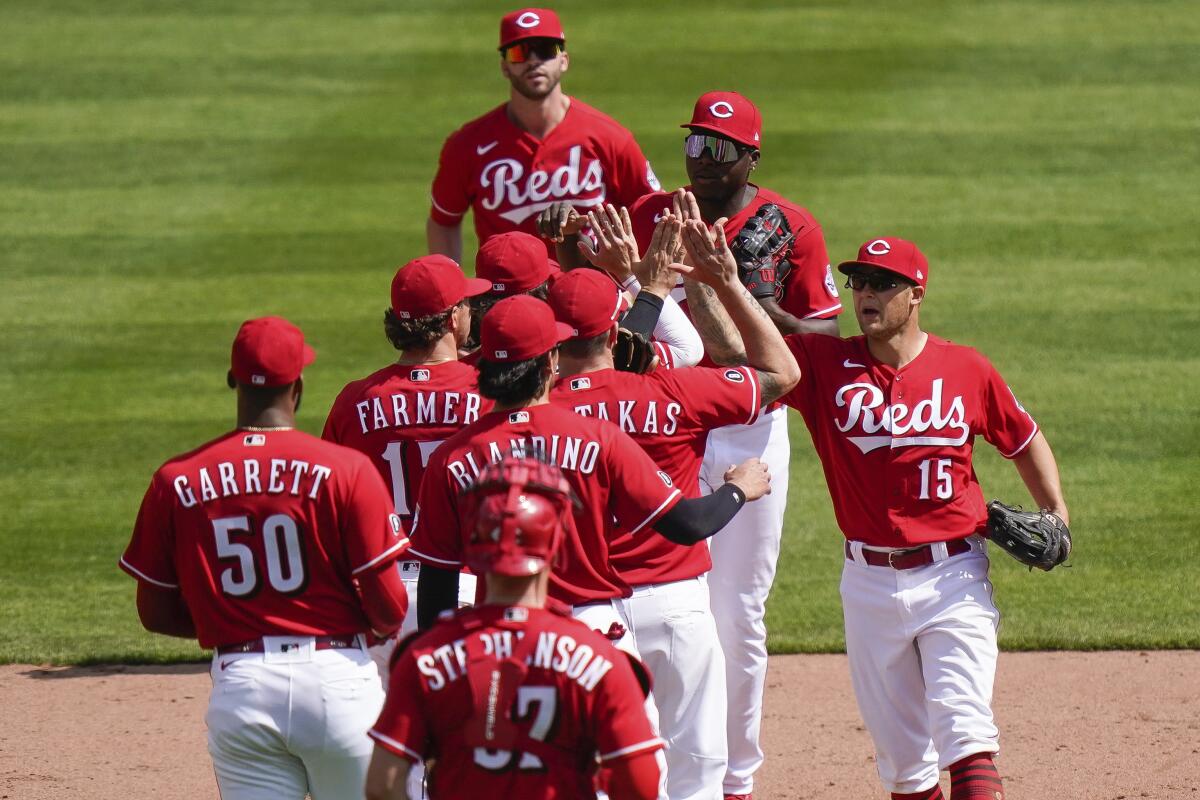 Reds keep rolling, hit 4 HRs to back Castillo, sweep Pirates