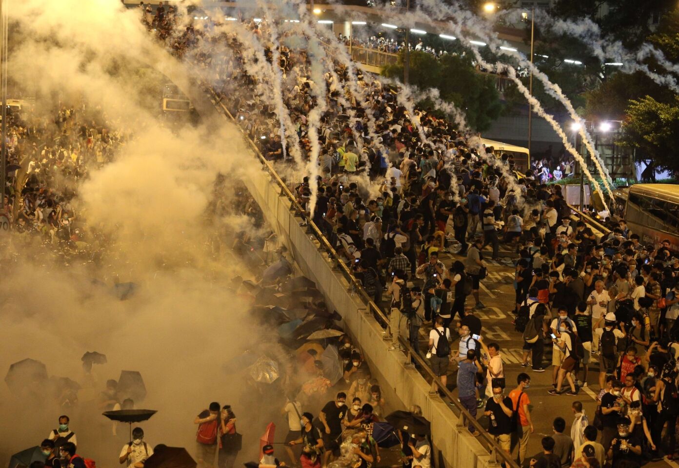 Police fire tear gas at pro-democracy demonstrators near the Hong Kong government headquarters on Sept. 28, 2014.