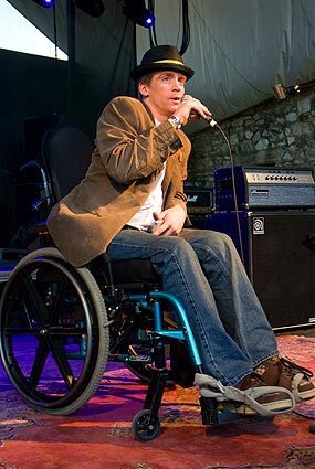 Tomas Young, an Iraq war veteran paralyzed after being shot only five days into his stint overseas, addresses the crowd at Stubbs Bar-B-Q in Austin, Texas, which had gathered to honor Young, who was promoting the documentary film Body of War. It details his evolution from solider to antiwar activist. The March 13 event was part of the South by Southwest Music Festival. Read the story: A war vet's unlikely seat in the spotlight