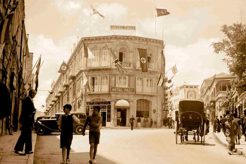 Hotel Fast in Jerusalem displays both British and Nazi flags in 1937.