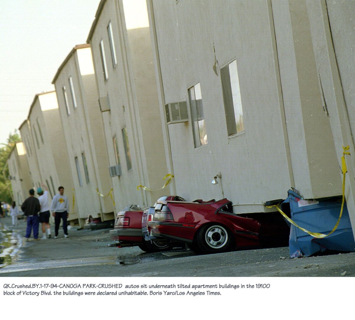 Buildings like this Canoga Park apartment complex, which collapsed in the 1994 Northridge quake, are at risk because their slender columns can't support them during strong shaking.