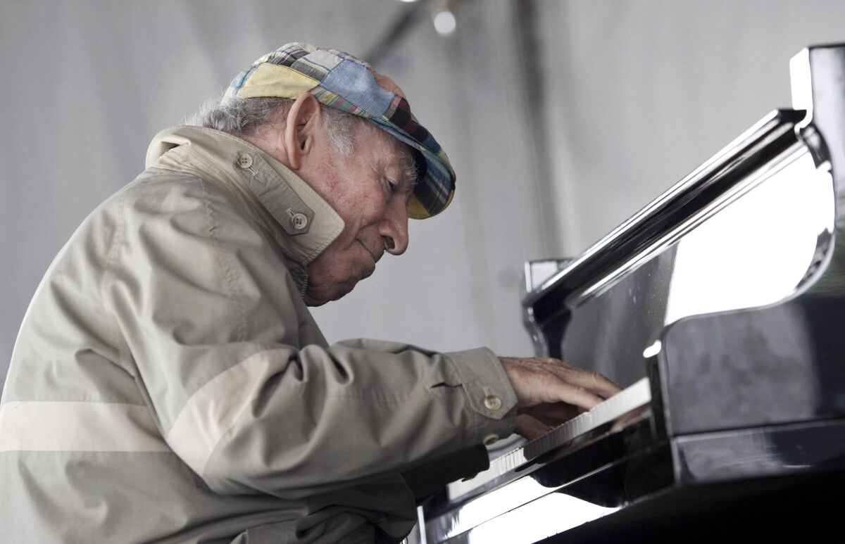 George Wein plays piano