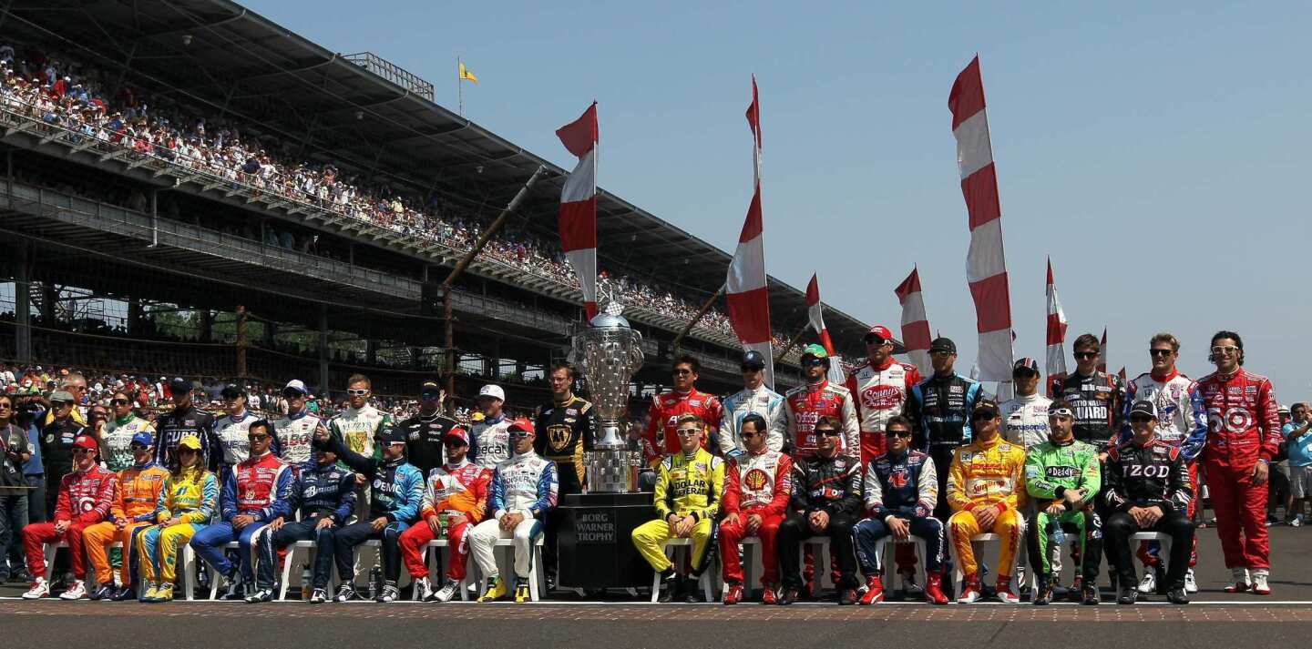 The field of drivers for the 96th Indianapolis 500 pose for a group photo before the start of the race on Sunday.
