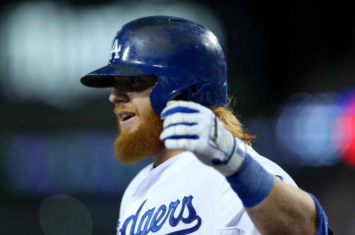 Justin Turner celebrates after hitting a home run in the first inning off San Francisco's Madison Bumgarner. Turner took Bumgarner deep a second time in the eighth inning.