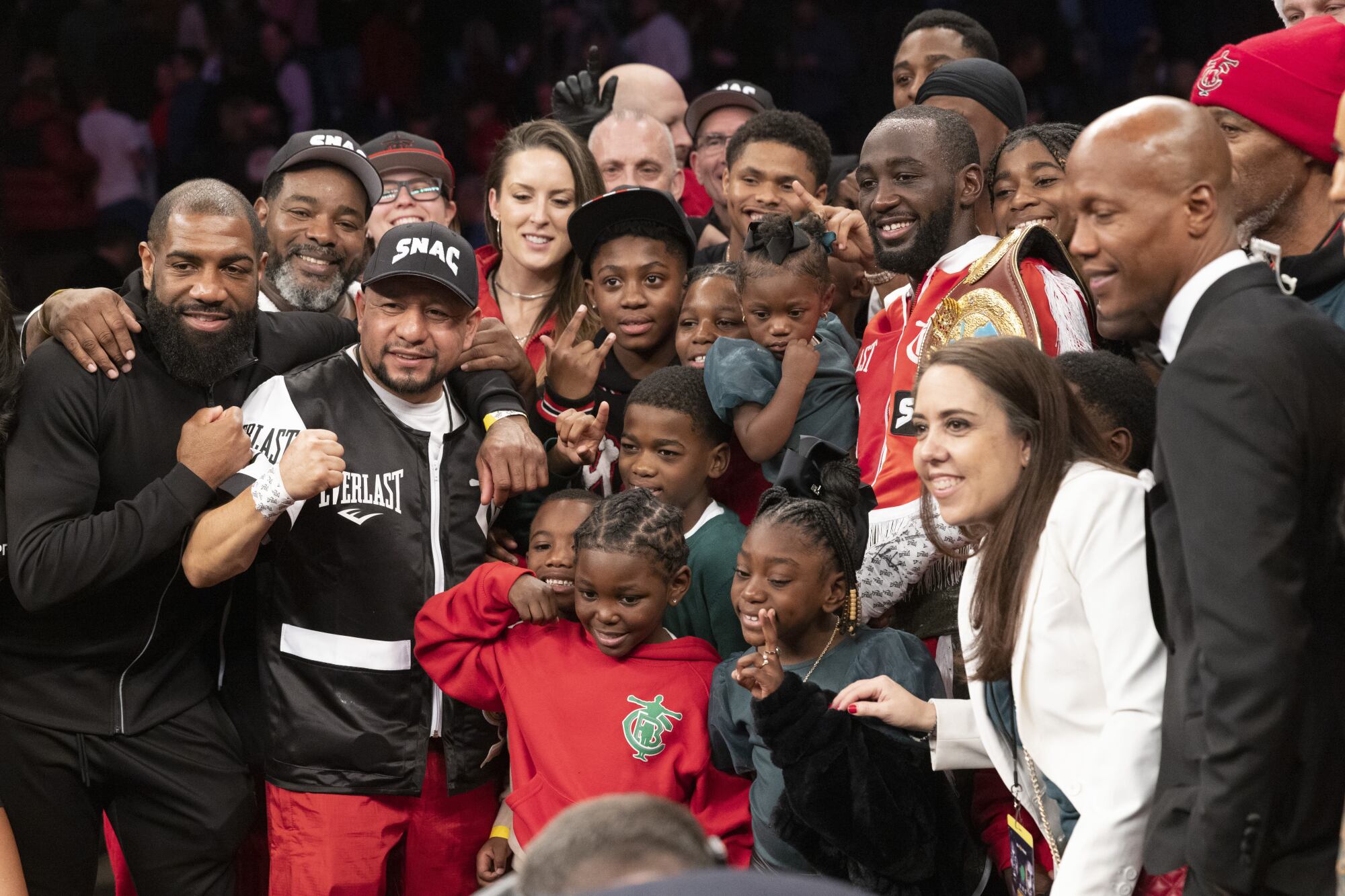 Terence Crawford poses for photos with his team and family after knocking out David Avanesyan on Dec. 10, 2022