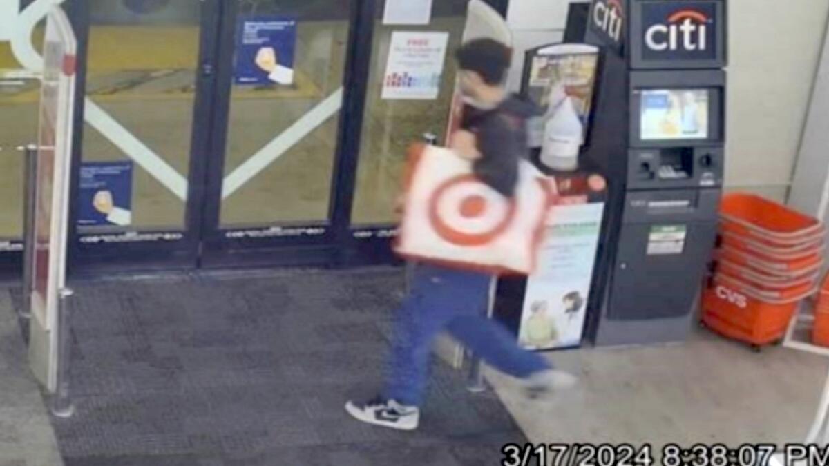 A security video shows a man walking into a store