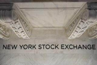 A sign is seen on the floor at the New York Stock Exchange in New York, Tuesday, March 28, 2023. (AP Photo/Seth Wenig)