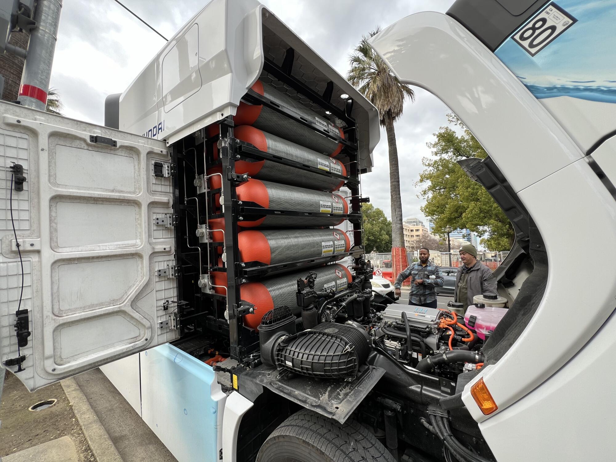 Hydrogen tanks under the hood of a fuel cell semi truck.