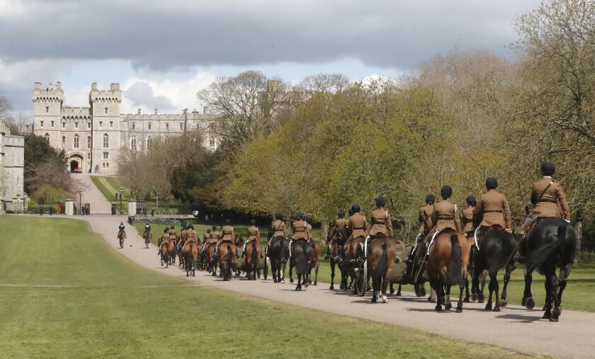 King's Troup Royal Horse Artillery rehearses on the long walk towards Windsor Castle in Windsor, Thursday, April 15, 2021. Britain's Prince Philip, husband of Queen Elizabeth II, died Friday April 9 aged 99. His funeral service will take place on Saturday at Windsor Castle. (AP Photo/Frank Augstein)
