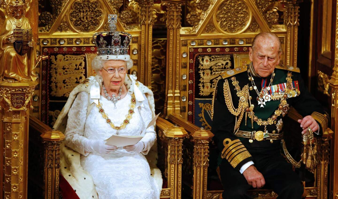 Britain's Queen Elizabeth II and Prince Philip, Duke of Edinburgh, as she delivers the Queen's Speech at the opening of Parliament on May 18, 2016.