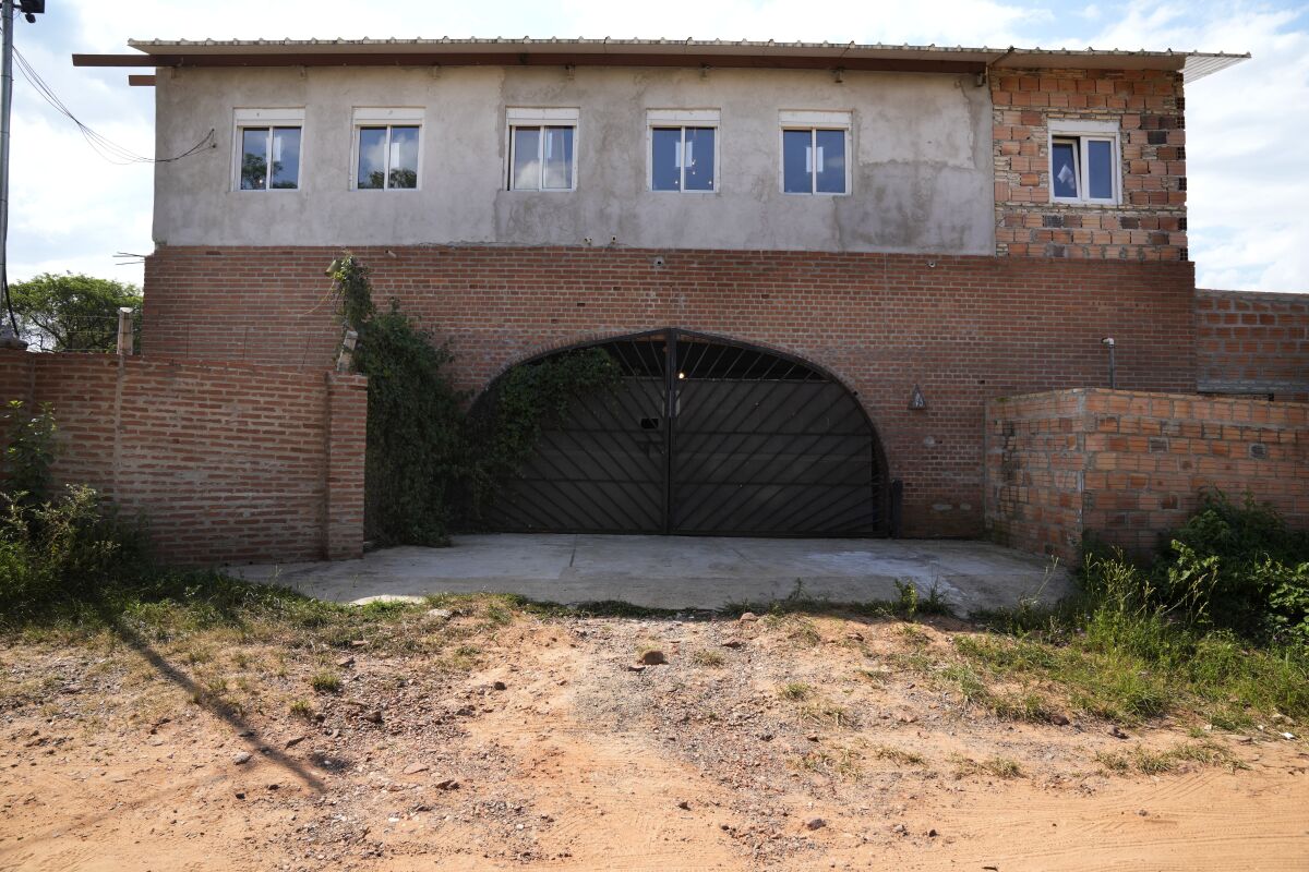 A view of the residence of German archeologist, musician and violin luthier, Bernard Raymond Von Bredow, in Aregua, Paraguay, Wednesday, Nov. 3, 2021. The bodies of Von Bredow, 62, and his 14-year-old daughter were found in the home on Oct. 22 with traces of violence. (AP Photo/Jorge Saenz)