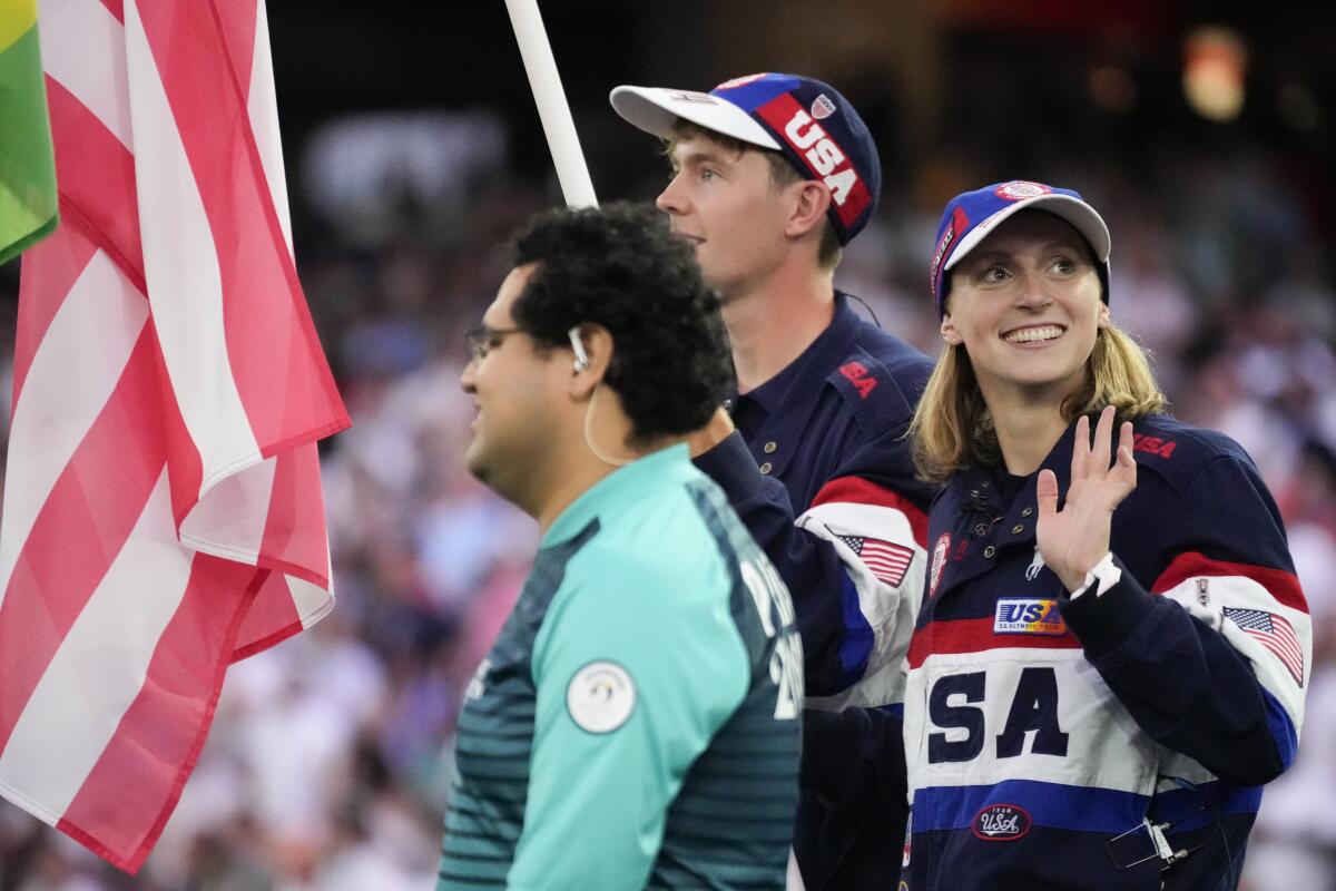 United States flag bearer's Katie Ledecky and Nick M dis)