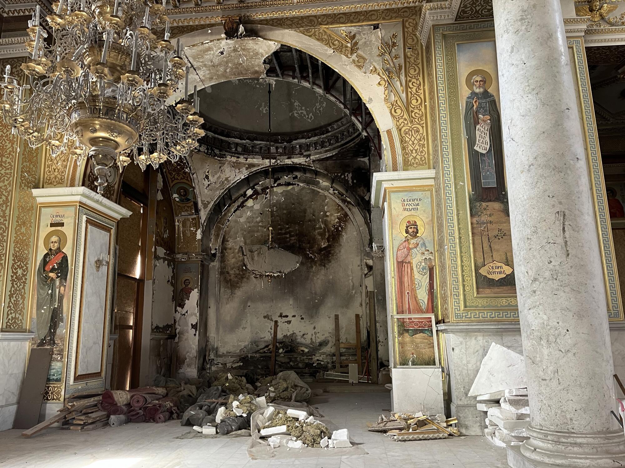 Rubble lies on the floor and walls are charred and blackened inside Odesa's Transfiguration Cathedral. 