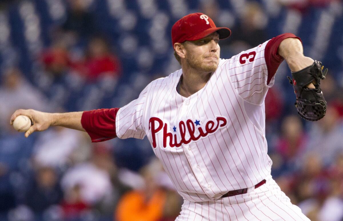 Roy Halladay pitches for the Phillies in 2013.