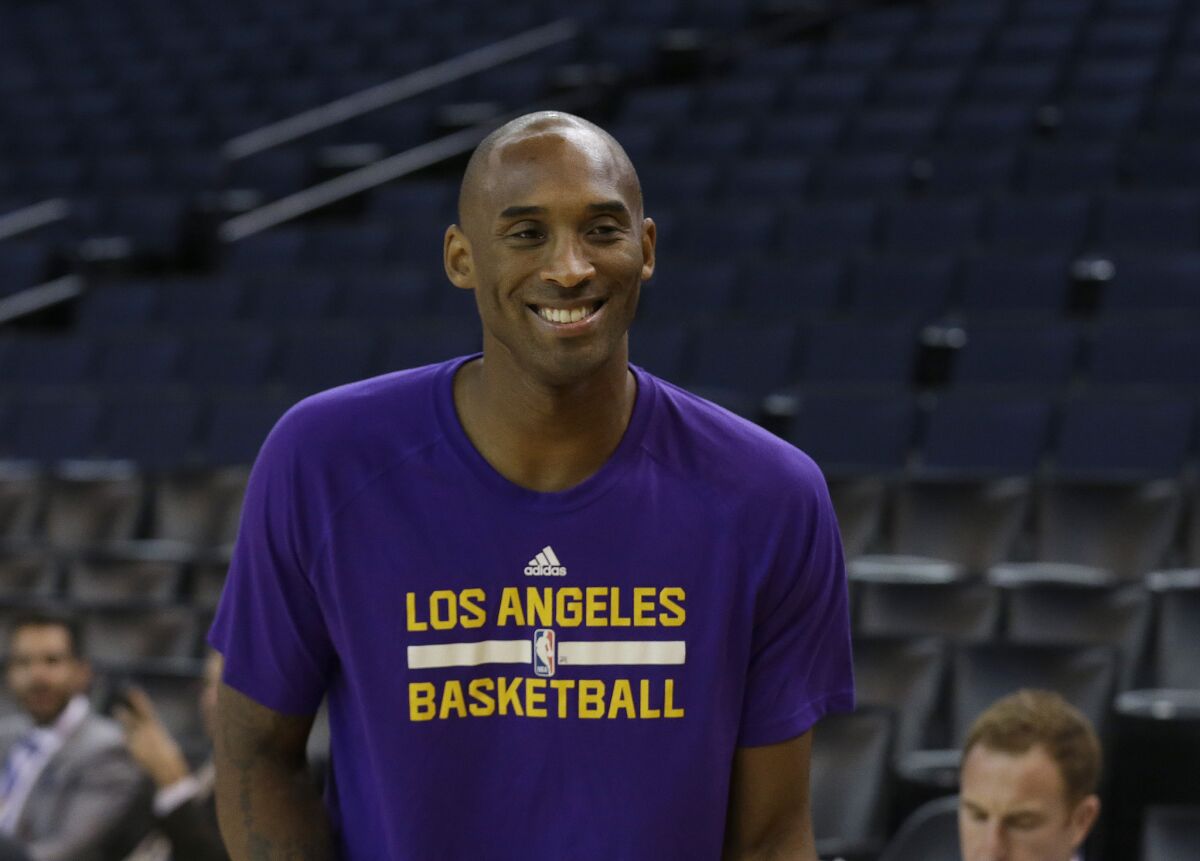 Los Angeles Lakers guard Kobe Bryant smiles before an NBA basketball game against the Golden State Warriors on Nov. 24.