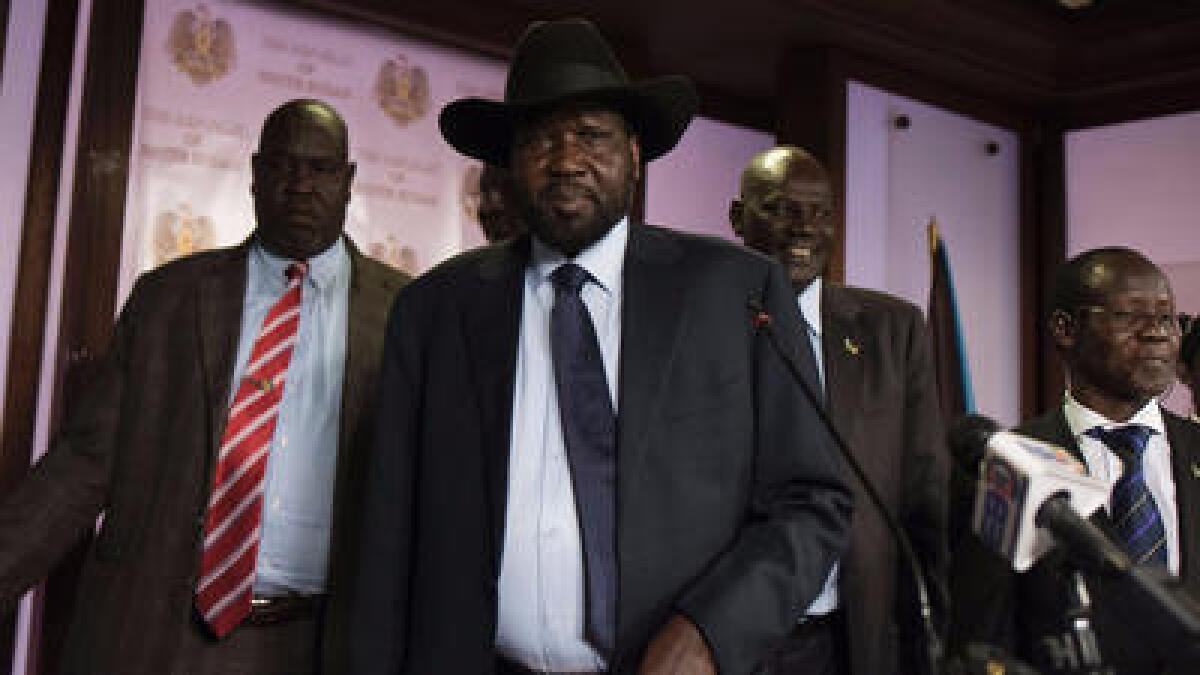 South Sudan President Salva Kiir leaves the conference room after artillery fire broke out near the presidential palace in Juba in South Sudan.