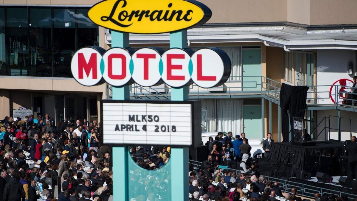 People listen to speakers during an event at the Lorraine Motel commemorating the 50th anniversary of the assassination of Martin Luther King Jr. on April 4 in Memphis, Tenn.