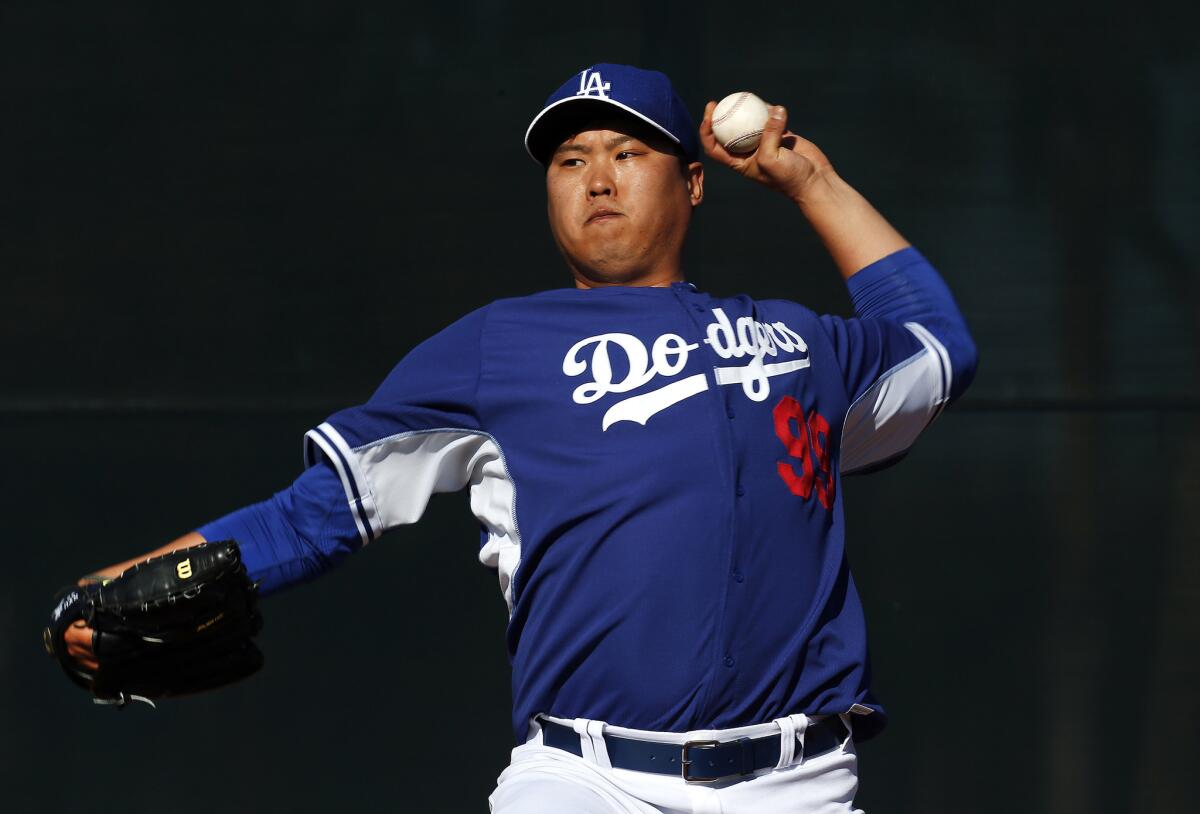 Dodgers left-hander Hyun-Jin Ryu throws a pitch during a spring training practice on Feb. 9. Ryu has not appeared in a single game this season because of his left shoulder injury.