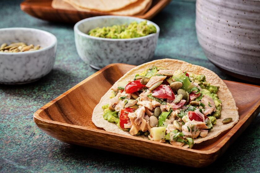 Loaded with fresh vegetables, these tuna salad tostadas are a light heart-healthy meal. 