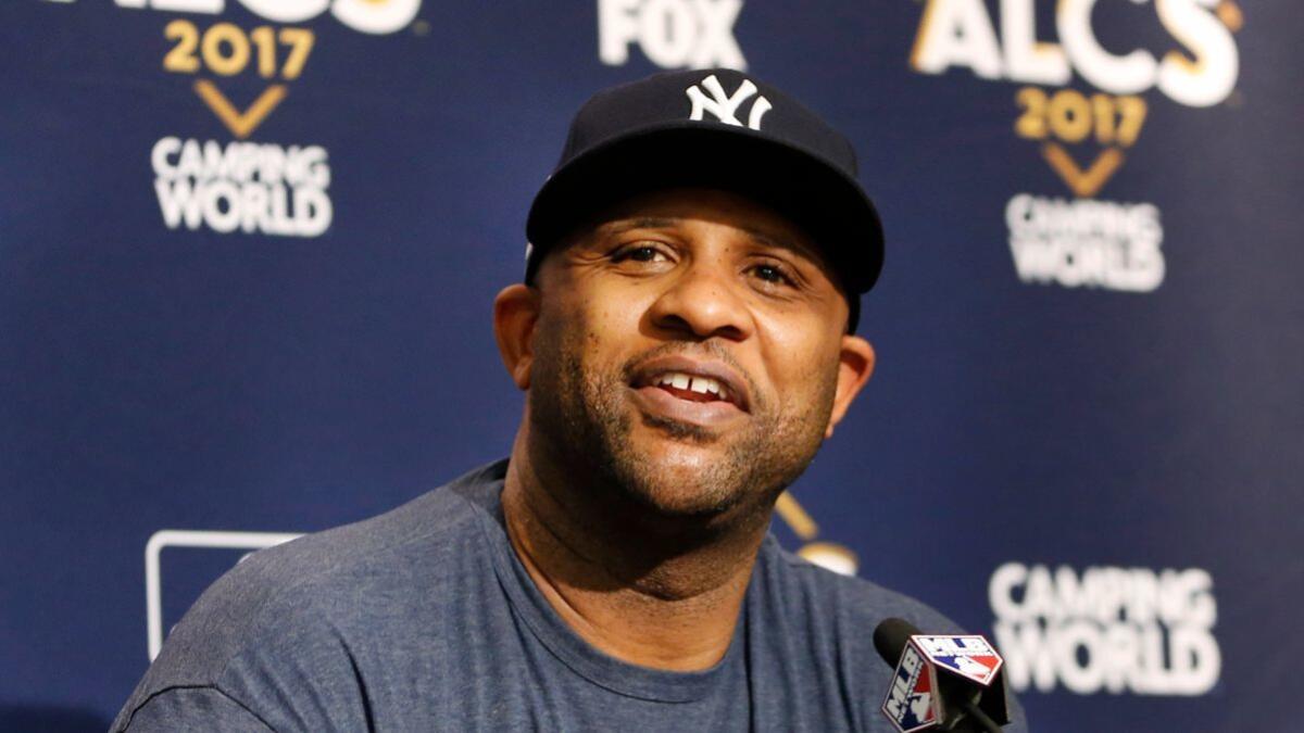 New York Yankees starting pitcher CC Sabathia answers reporters' questions during a news conference before a team workout day on Sunday.