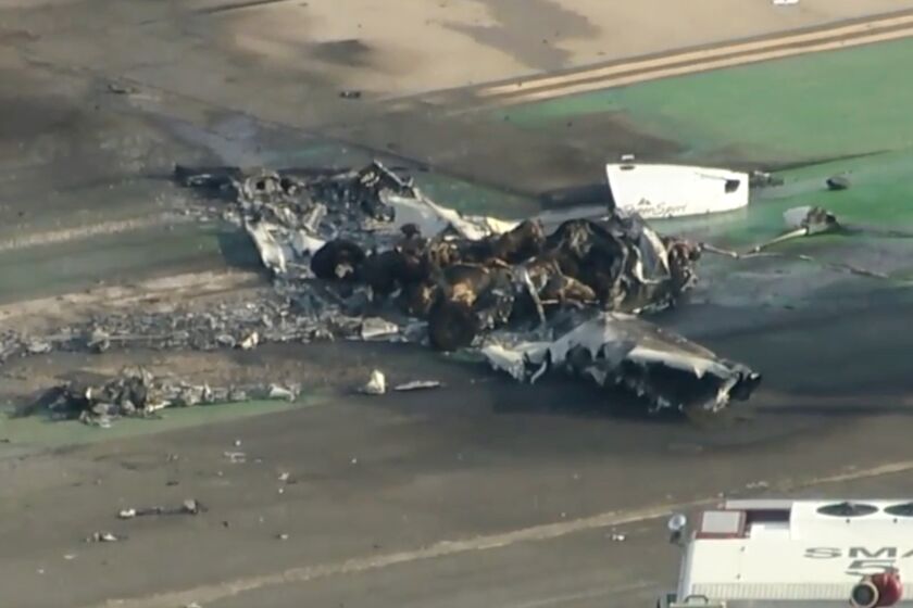 FILE - In this image taken from video, firefighters respond to a small plane crash in Santa Monica, Calif., on Thursday, Sept. 8, 2022. Authorities say two people were killed when the single-engine airplane crashed and caught fire at Southern California's Santa Monica Airport. Witnesses reported seeing a small plane make a hard landing, immediately take off again and then climb erratically before slamming into the runway nose-first, killing both people on board, according to a preliminary report into last month's crash at Santa Monica Airport. (KABC-7 via AP, File)