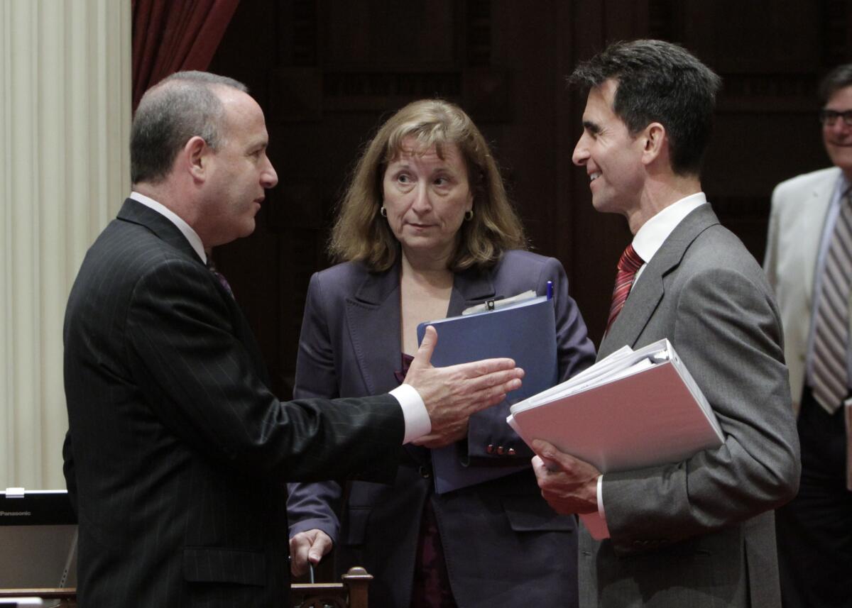 State Senate President Pro Tem Darrell Steinberg, left, talks with Sen. Ellen Corbett and Senate Budget Committee Chairman Mark Leno in 2011. Corbett was appointed to a state board after being termed out of office