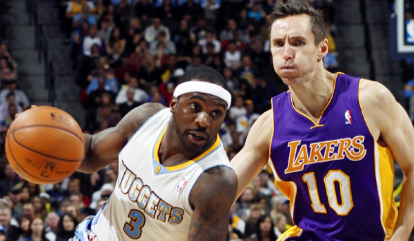 Denver guard Ty Lawson drives Steve Nash during the Nuggets' 126-114 victory over the Lakers last month.