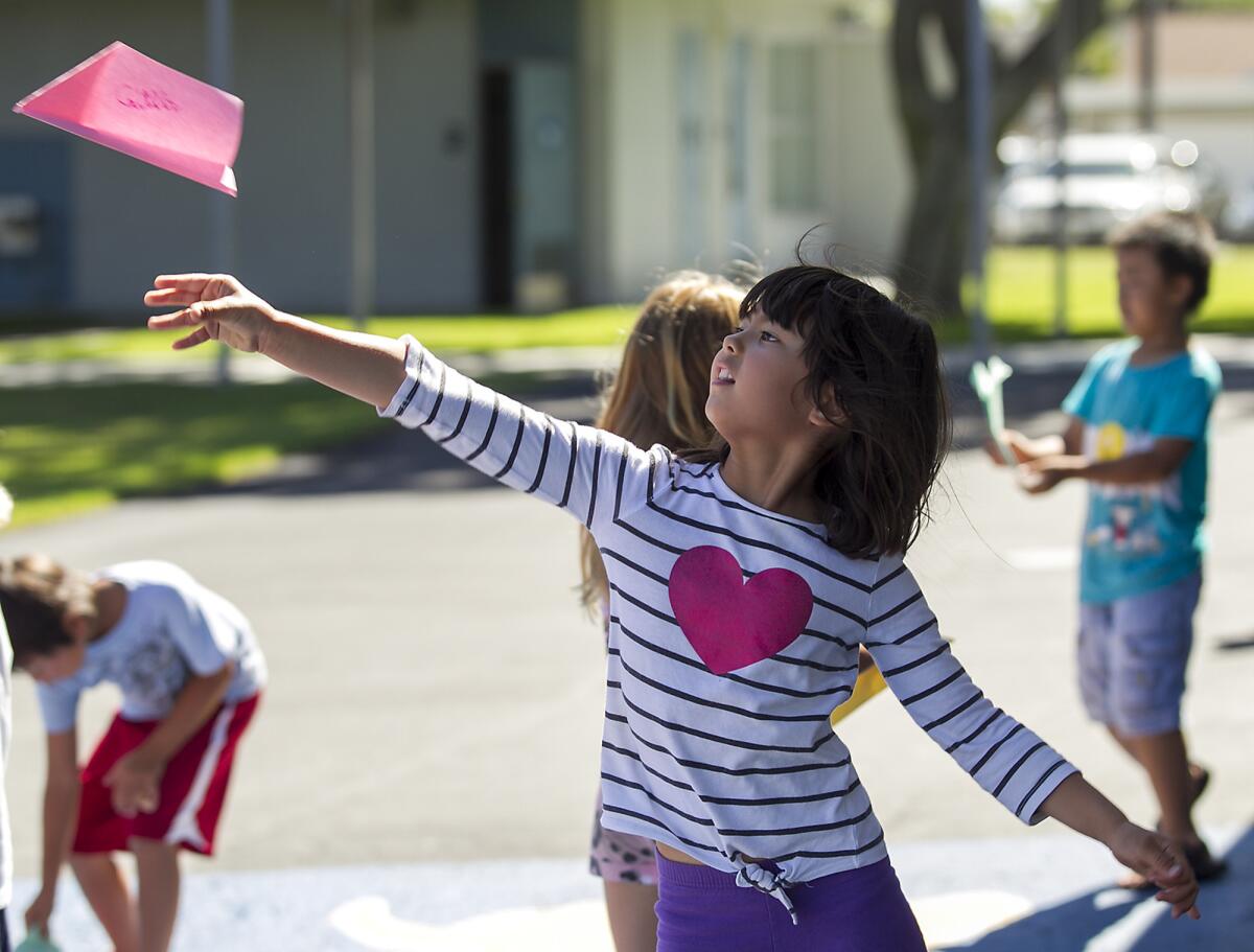 Caitlin Stayt, 7, launches her paper airplane during the final day of summer engineering camp at Killybrooke Elementary School on Thursday, July 24.