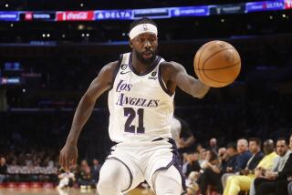 Los Angeles Lakers guard Patrick Beverley (21) chases a ball against the San Antonio Spurs during the first half of an NBA basketball game Sunday, Nov. 20, 2022 in Los Angeles. (AP Photo/Ringo H.W. Chiu)